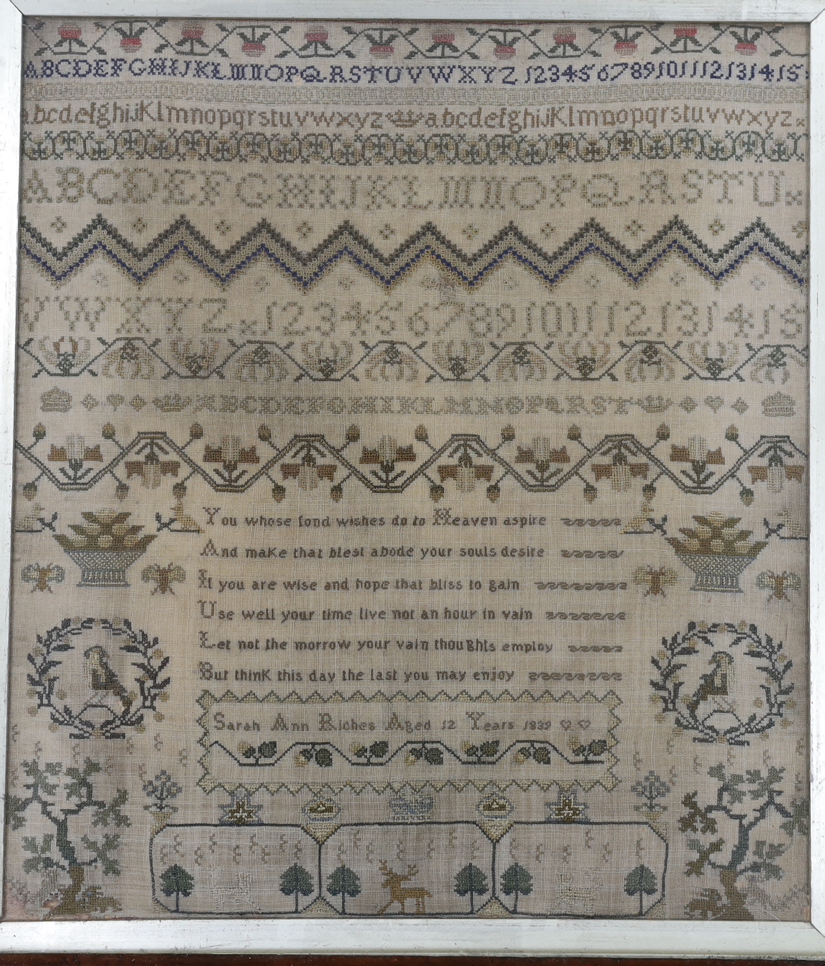 A framed early Victorian very finely worked cross stitch alphabet and spot motif sampler, dated 1839, by Sarah Ann Riches aged 12 years, 30cm wide x 33cm high